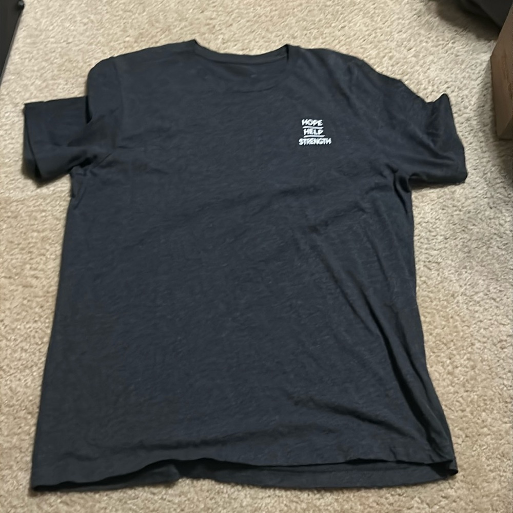 Black tee with a positive message